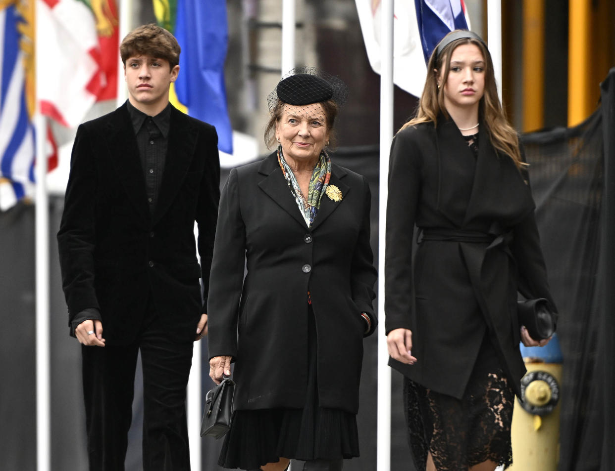 Margaret Trudeau (center), mother of Canadian Prime Minister Justin Trudeau, walks with her grandchildren Xavier (left) and Ella-Grace (right) as they arrive at Christ Church Cathedral for the National Commemorative Ceremony in honor of Queen Elizabeth, in Ottawa, on Sept. 19, 2022. (Justin Tang / AP)