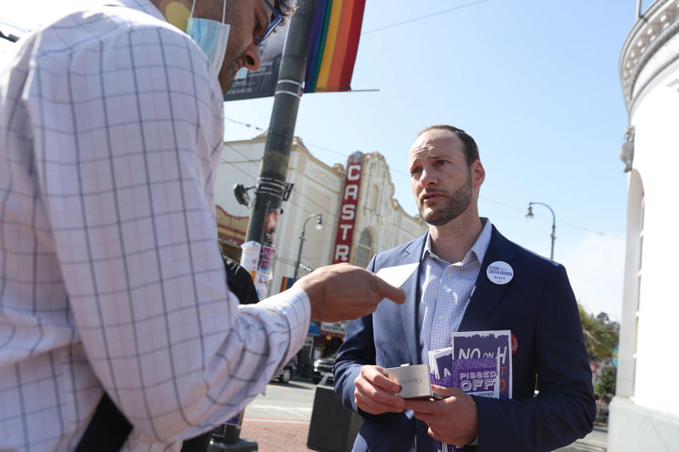 Former district attorney Chesa Boudin greets potential voters in San Francisco on June 7, 2022.