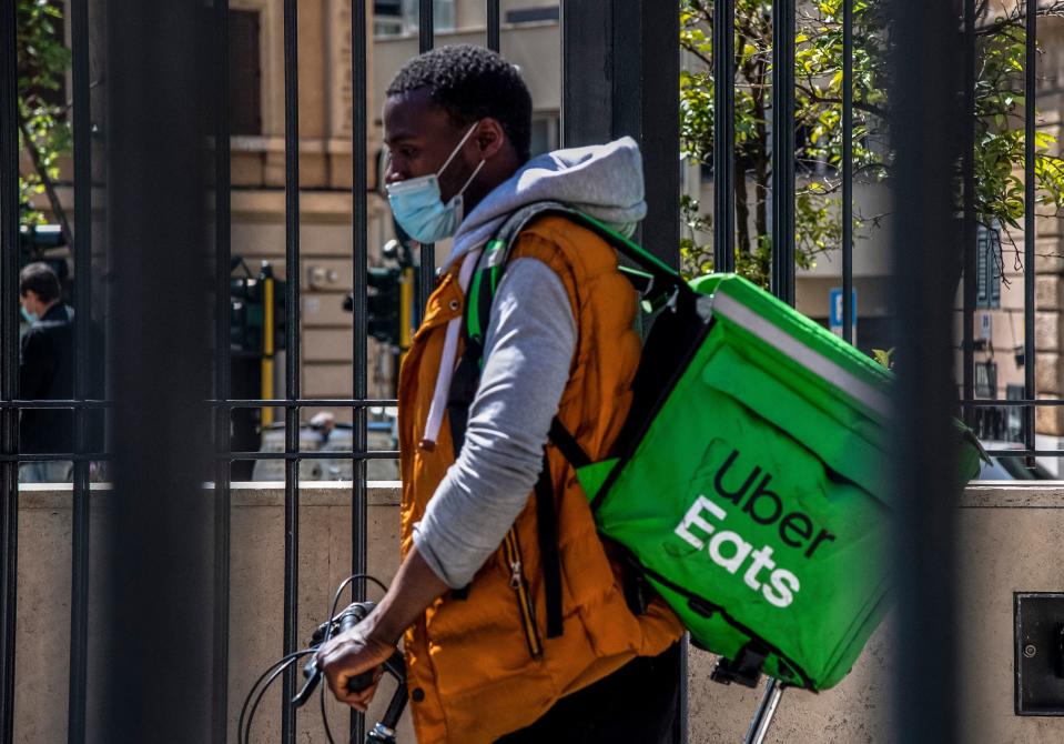 A delivery man exits with his bicycle the San Giovani underground metro station during a test phase in Rome, on April 27, 2020, during the country's lockdown aimed at curbing the spread of the COVID-19 infection, caused by the novel coronavirus. - First tests were under way for subway access with security measures to avoid coronavirus infection in "Phase 2", that will re-open on May 4. (Photo by Tiziana FABI / AFP) (Photo by TIZIANA FABI/AFP via Getty Images)