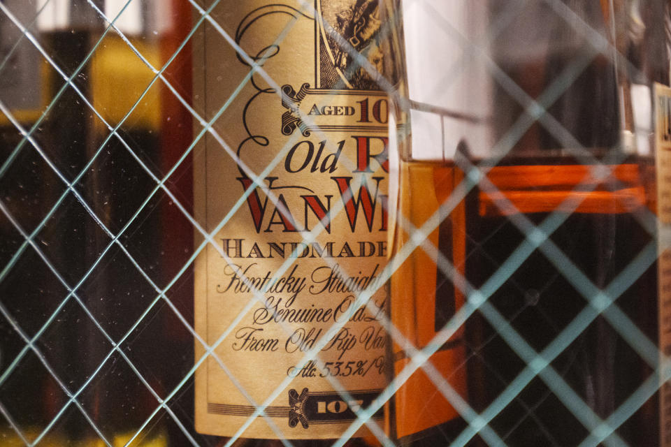 A bottle of Old Pappy Van Winkle bourbon, a 10-year-old, is shown behind glass doors at "Seven Grand," a whiskey bar downtown Los Angeles Saturday, March 4, 2023. Seven Grand offers an extensive selection of over 700 different whiskies from around the world, including rare and hard-to-find bottles. (AP Photo/Damian Dovarganes)