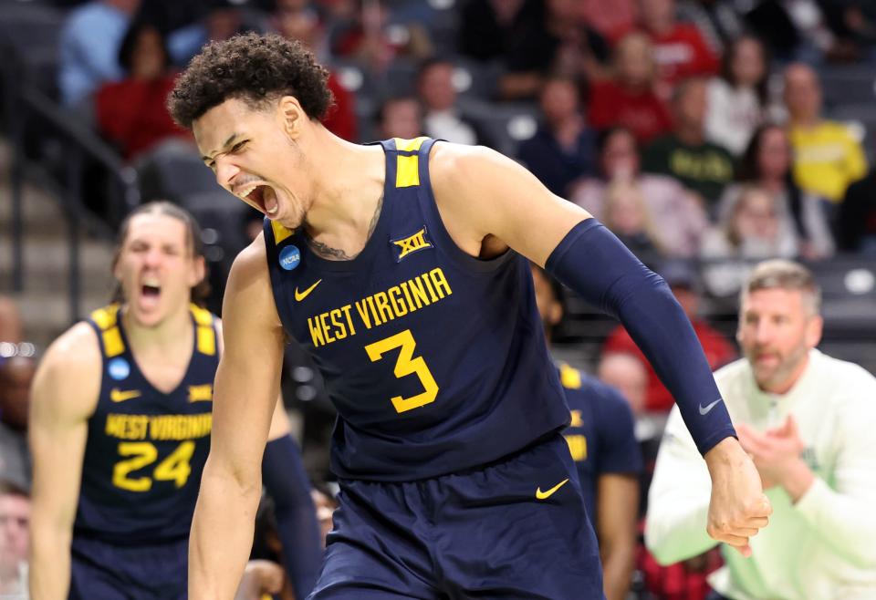 West Virginia Mountaineers forward Tre Mitchell (3) reacts after scoring a basket while being fouled against the Maryland Terrapins during the second half in the first round of the 2023 NCAA Tournament at Legacy Arena on Mar 16, 2023 in Birmingham, AL.