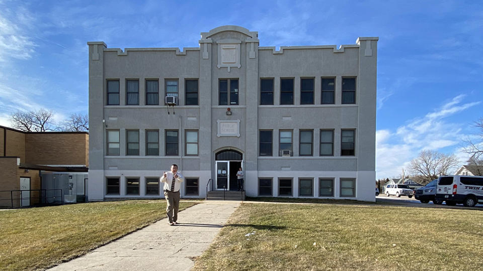 Principal Ken Sheets gives two thumbs up to students and staff after a fire drill in December. The high school building in Taylor celebrated its 100th anniversary in 2021. (Laura Fay/The 74)