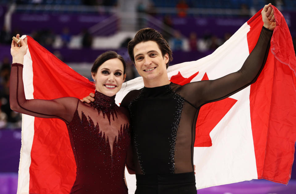 Gold medal winners Tessa Virtue and Scott Moir of Canada celebrate during the victory ceremony for the Figure Skating Ice Dance Free Dance on day eleven of the PyeongChang 2018 Winter Olympic Games. (Getty Images)