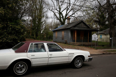 A car drives by the house, slated to be moved to a new location, where singer Aretha Franklin was born in Memphis, Tennessee, U.S., March 29, 2018. REUTERS/Jonathan Ernst