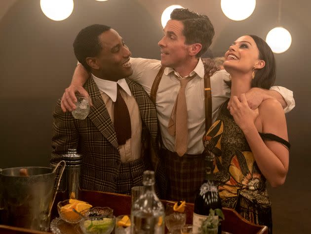 This image released by 20th Century Studios shows, from left, John David Washington, Christian Bale and Margot Robbie in a scene from 