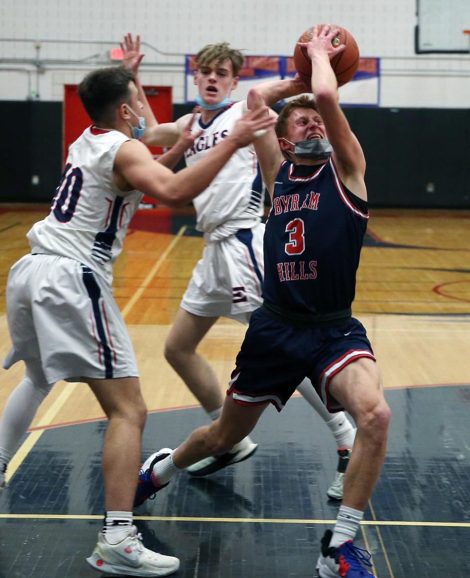 Byram Hills' Danny Bernstein (3) drives to the basket in front of Eastchester's Frankie Provenzale (10) during boys basketball action at Eastchester High School on Jan. 12. Byram Hills won the game in overtime 60-53.