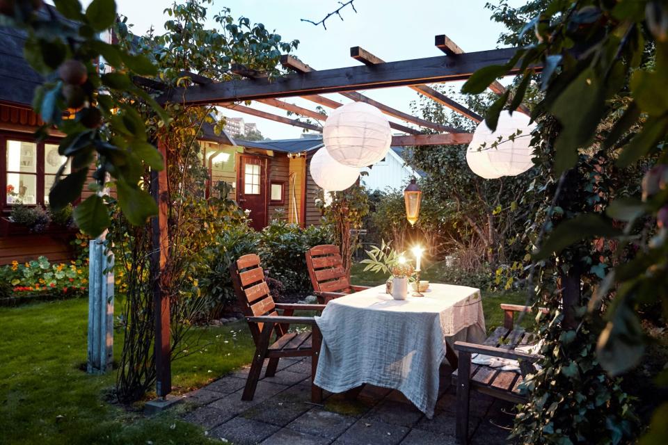 Table set in garden under pergola