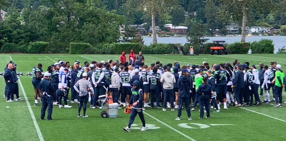 New coach Mike Macdonald gathers his Seahawks around him at the end of the seventh of 10 NFL organized team activities (OTAs) practices at the Virginia Mason Athletic Center along Lake Washington in Renton on June 3, 2024.