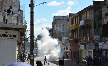 Riot police fire tear gas canisters at a street to disperse opposition demonstrators protesting against new electoral laws in Antananarivo, Madagascar April 21, 2018. REUTERS/Clarel Faniry Rasoanaivo