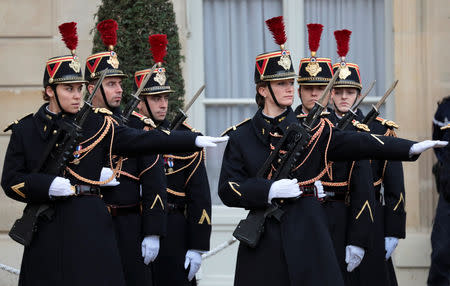 Members of the French Republican Guard are seen at the Elysee Palace ahead of the commemoration ceremony for Armistice Day, 100 years after the end of World War One, in Paris, France, November 11, 2018. REUTERS/Reinhard Krause