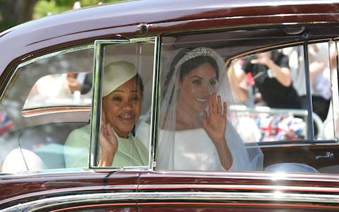 Meghan Markle (R) and her mother, Doria Ragland arrive for her wedding ceremony to marry Britain's Prince Harry, Duke of Sussex, at St George's Chapel - Credit: OLI SCARFF/AFP