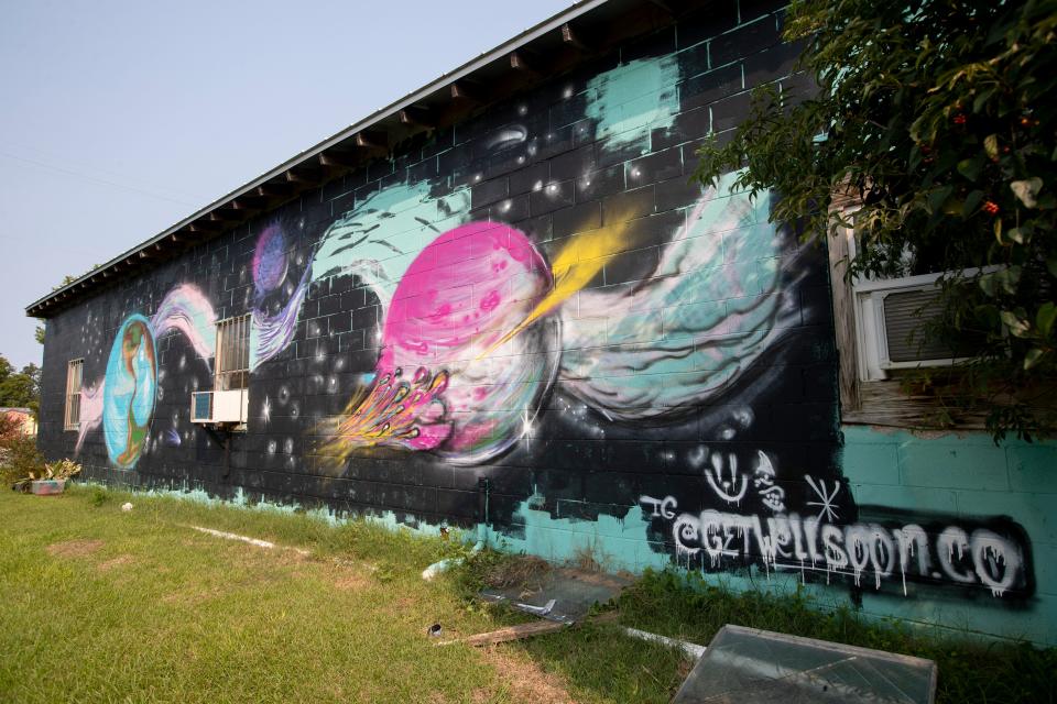 A non-commissioned mural has popped up on the back of a Railroad Square Art District building facing FAMU Way. The mural is signed with the Instagram handle "@getwelsoon.co" and a smiley face which is also tagged in many other places around town. 