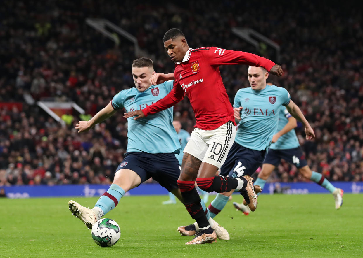 Marcus Rashford of Manchester United is challenged by Taylor Harwood-Bellis of Burnley during the Carabao Cup match.