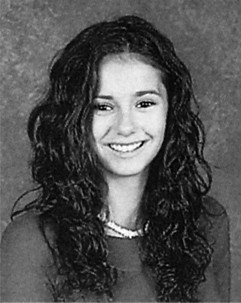 Nina Dobrev is gorgeous in her sophomore year photo. We love the scrunched curls and that on-trend puka shell necklace.