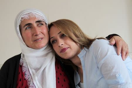 Nezahat Eleftos (L) is pictured with her daughter Leyla at her home in Diyarbakir, in the Kurdish-dominated southeastern Turkey, April 20, 2015. REUTERS/Sertac Kayar