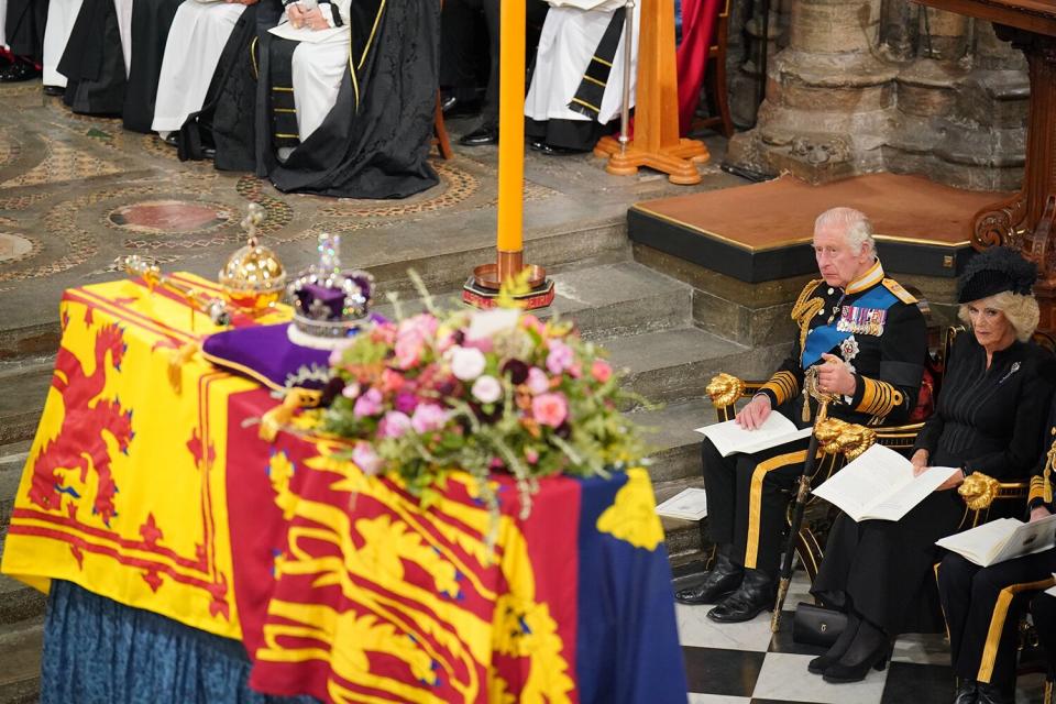 King Charles III and Camilla, Queen Consort, during the State Funeral of Queen Elizabeth II at Westminster Abbey on September 19, 2022 in London, England.