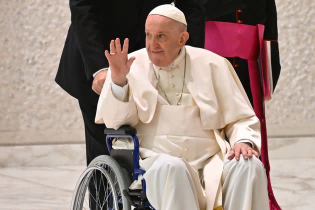 Pope Francis waves as he arrives at a Vatican conference on Thursday.  (Photo: ALBERTO PIZZOLI via Getty Images)