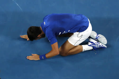Tennis - Australian Open - Men's Singles Final - Melbourne Park, Melbourne, Australia, January 27, 2019. Serbia's Novak Djokovic reacts after winning his match against Spain's Rafael Nadal. REUTERS/Adnan Abidi