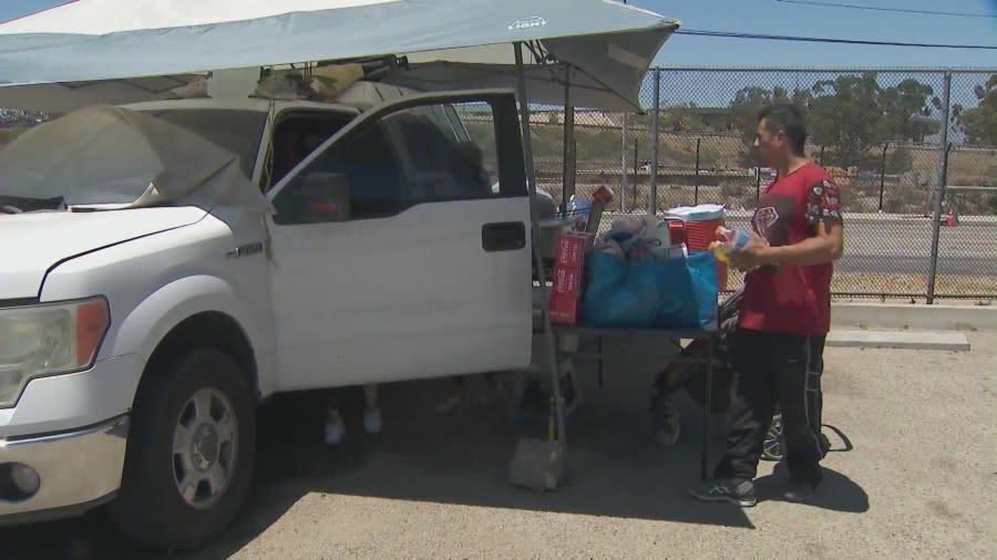 The Morales family, who are homeless, are seen spending an afternoon together outside of the truck they live in at a Pacoima park on July 4, 2024. (KTLA)