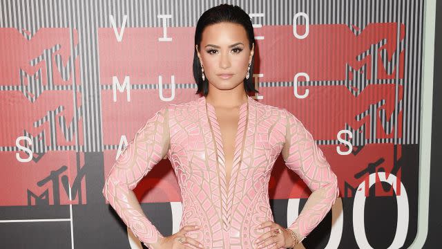 <strong>Demi Lovato</strong> is opening up about the death of her father. "The last song that I recorded [for the new album] was called 'Father,'" Lovato tells Billboard. "I'm particularly excited for this song." <strong> WATCH: Demi Lovato Talks 'Confident' Album Cover </strong> Lovato's estranged father lost his battle with cancer in 2013, and the singer previously tweeted thanks to her fans for their support in her time of need. "I feel so humbled to have had so much support from my fans, friends, family and complete strangers... God bless you all, thank you so much," she wrote at the time. <strong> NEWS: Demi Lovato Is Feeling 'Humbled' After the Death of Her Father </strong> Now, she's channeling her emotions into her music. "I get very, very honest about the passing of my dad," she said in the Sept. 1 interview. "My fans expect me to be honest, [but] what I think that people in general aren't going to expect is the way that I sing the song. I took it more to a soulful, gospel kind of sound, and it's the song that I think I might be most proud of on the album." Lovato's new album, <em>Confident</em>, is due out this October. Last week, the 23-year-old unveiled the super sexy album cover, in which she strikes a pose in black panties and a skin-tight, shiny black top. "The album is called 'Confident,'" she told ET on the red carpet at the MTV Video Music Awards. "And I wanted something that was going to best represent the album title, where I'm at today and the music." <strong> WATCH: Whoa! Demi Is Looking GOOD on the Cover of Her New Album </strong> "I've never been more confident in my life and it was the perfect album title," she added. See the interview (and Lovato's gorgeous pink dress) in the video below.