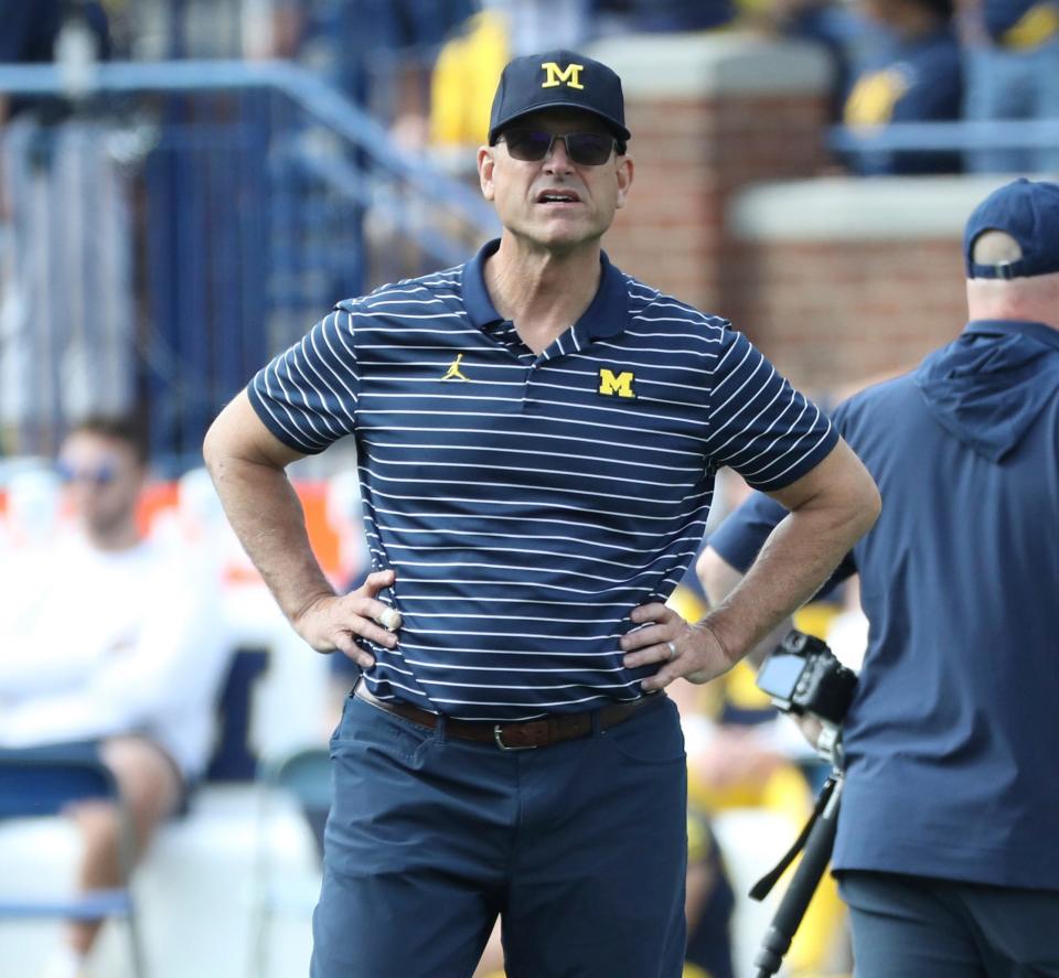 Michigan Wolverines head coach Jim Harbaugh watches his team warm up before action against the Rutgers Scarlet Knights in Ann Arbor, Michigan on Saturday, Sept. 23 2023.