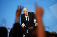 Conservative party leadership candidate Boris Johnson answers questions during a Conservative leadership hustings at ExCel Centre in London, Wednesday, July 17, 2019. The two contenders, Jeremy Hunt and Boris Johnson are competing for votes from party members, with the winner replacing Prime Minister Theresa May as party leader and Prime Minister of Britain's ruling Conservative Party. (AP Photo/Frank Augstein)