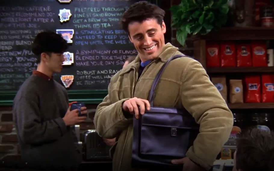 In the “Friends” episode “The One With Joey’s Bag,” the on-screen himbo touts an understated, black leather shoulder bag despite ridicule from his pals. Warner Bros