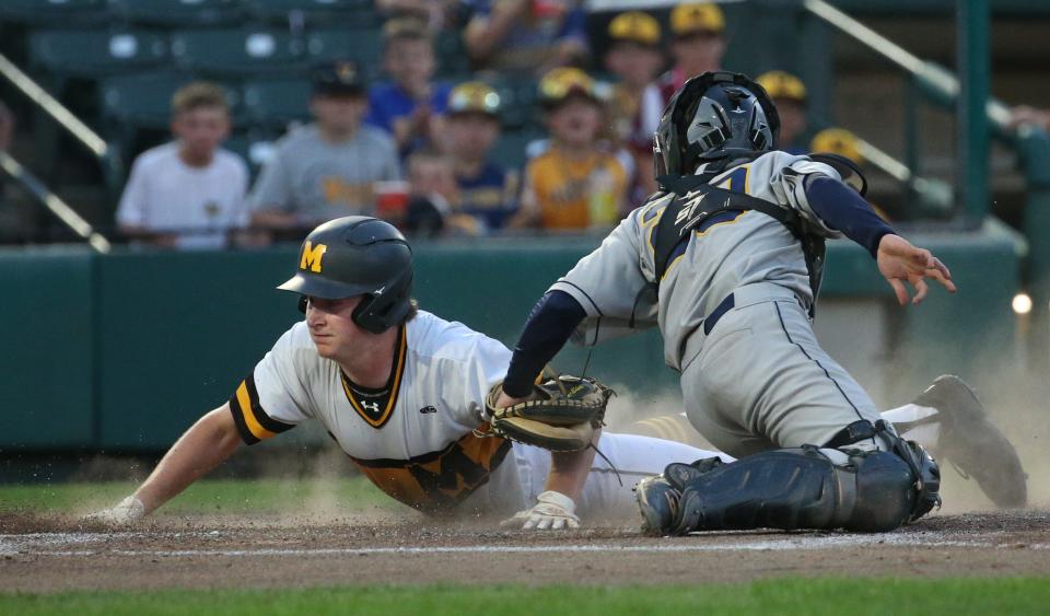 McQuaid's Daniel McAliney slides safely home ahead of the tag by Victor catcher Zack Prior giving McQuaid a 2-0 lead in the second inning during their Section V Class AA championship final at Frontier Field Tuesday, May 31, 2022 in Rochester.  McQuaid won the game and championship 2-1.