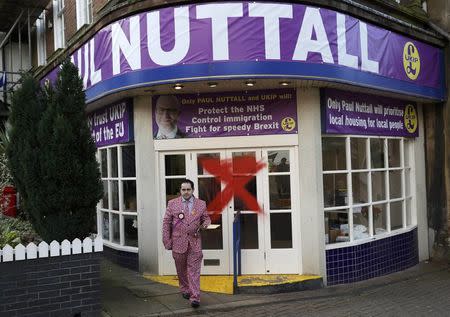 A supporter leaves the vandalised UKIP campaign office after their leader Paul Nuttall lost the Stoke Central by-election in Stoke on Trent, February 24, 2017. REUTERS/Darren Staples