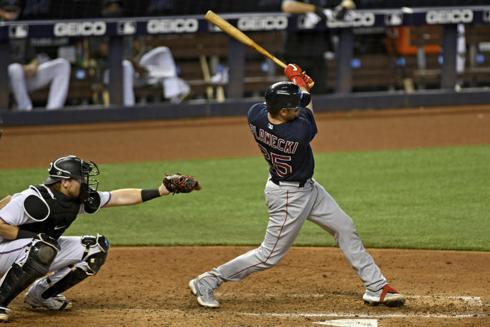 Boston Red Sox's Kevin Plawecki hits a single during the sixth inning of a baseball game against the Miami Marlins, Thursday, Sept. 17, 2020, in Miami. (AP Photo/Gaston De Cardenas)