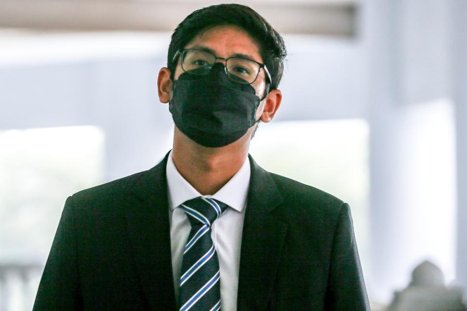 Bank Negara Malaysia analyst Adam Ariff Mohd Roslan arrives to testify against former prime minister Datuk Seri Najib Razak at the Kuala Lumpur Court Complex on August 30, 2023. — Picture by Hari Anggara