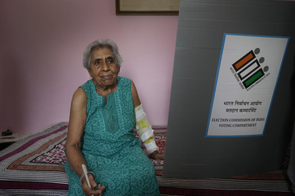 Vijay Lakshmi, 85, sits with an injured arm after casting her vote at home in New Delhi, India, Friday, May 17, 2024. The Election Commission of India for the first time has provided the facility of home voting for the elderly and persons with disabilities in the 2024 national elections. (AP Photo/Manish Swarup)