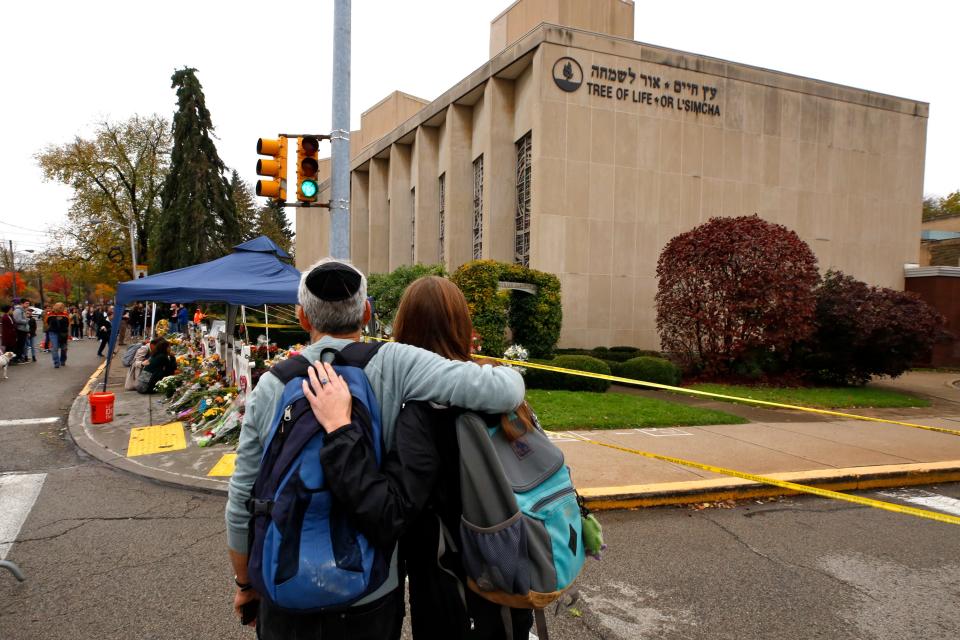 PITTSBURGH: People pay their respects at a makeshift memorial outside the Tree of Life Synagogue in the Squirrel Hill neighborhood of Pittsburgh on Nov. 2, 2018. Eleven people were killed in a shooting on Oct. 27, 2018, while worshipping.