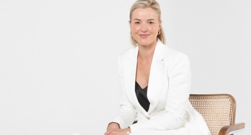 Isabella Loneragan sitting on chair in studio.