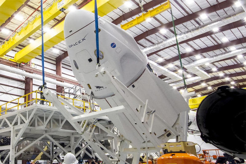 A refurbished SpaceX Crew Dragon capsule is prepared for launch next week to ferry two NASA astronauts, a Japanese flier and a Frenchman to the International Space Station. It will be the third piloted flight of a SpaceX commercial crew ship. / Credit: NASA/SpaceX