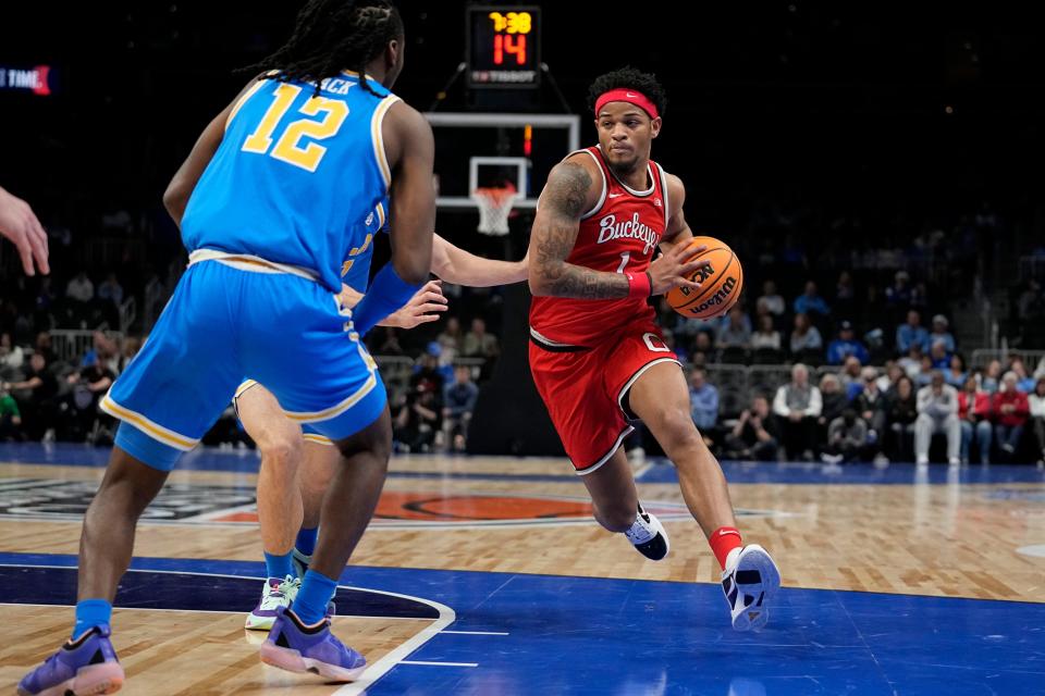 Ohio State guard Roddy Gayle Jr. (1) dribbles the ball during the first half of an NCAA college basketball game against UCLA Saturday, Dec. 16, 2023, in Atlanta, Ga. (AP Photo/Brynn Anderson)