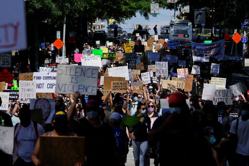 Protesters rally against racial inequality and the police shooting death of Rayshard Brooks, in Atlanta