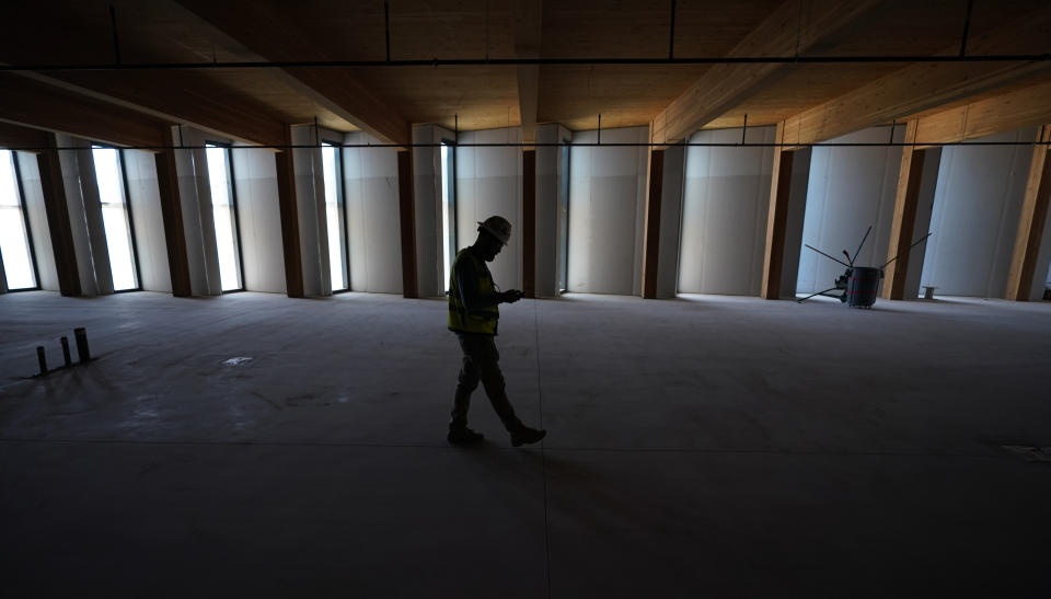 A construction manager walks through the San Antonio Spurs' soon-to-be-ready NBA basketball practice facility, Sunday, June 25, 2023, in San Antonio. (AP Photo/Eric Gay)