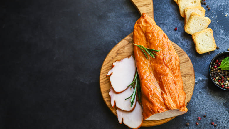 Roasted turkey breast on wooden platter