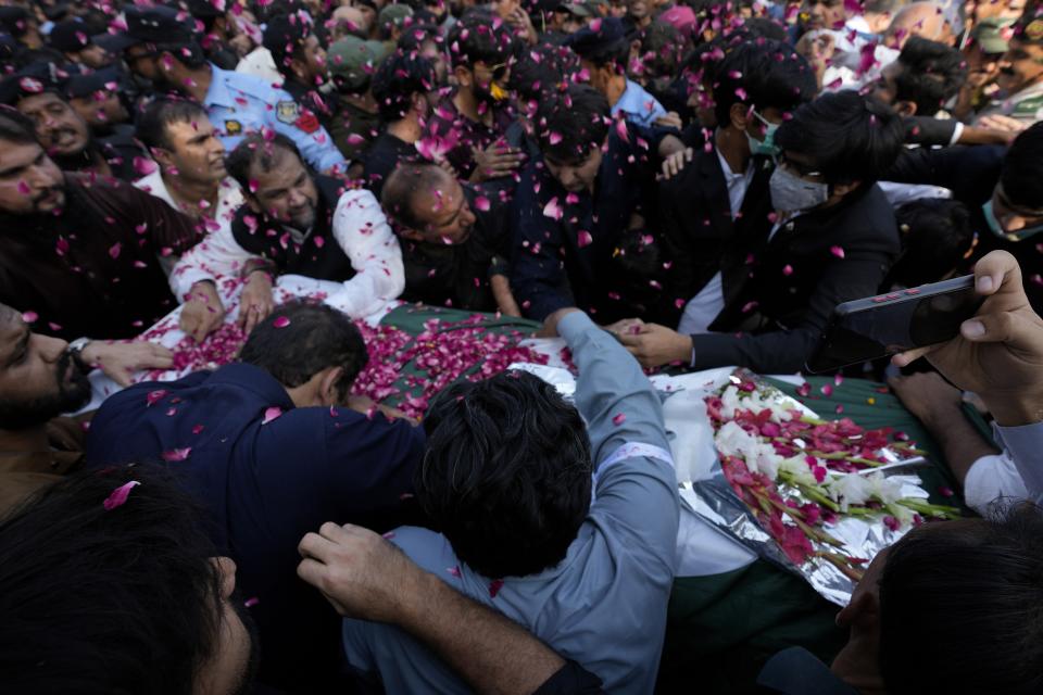 People attend the funeral prayer of slain senior Pakistani journalist Arshad Sharif, in Islamabad, Pakistan, Thursday, Oct. 27, 2022. Thousands of mourners in the capital, Islamabad on Thursday attended the funeral of the outspoken Pakistani journalist who was shot and killed by Nairobi police, as the spy chief and the military spokesman paid tributes to him because of his journalistic work and demanded a probe into his killing. (AP Photo/Anjum Naveed)