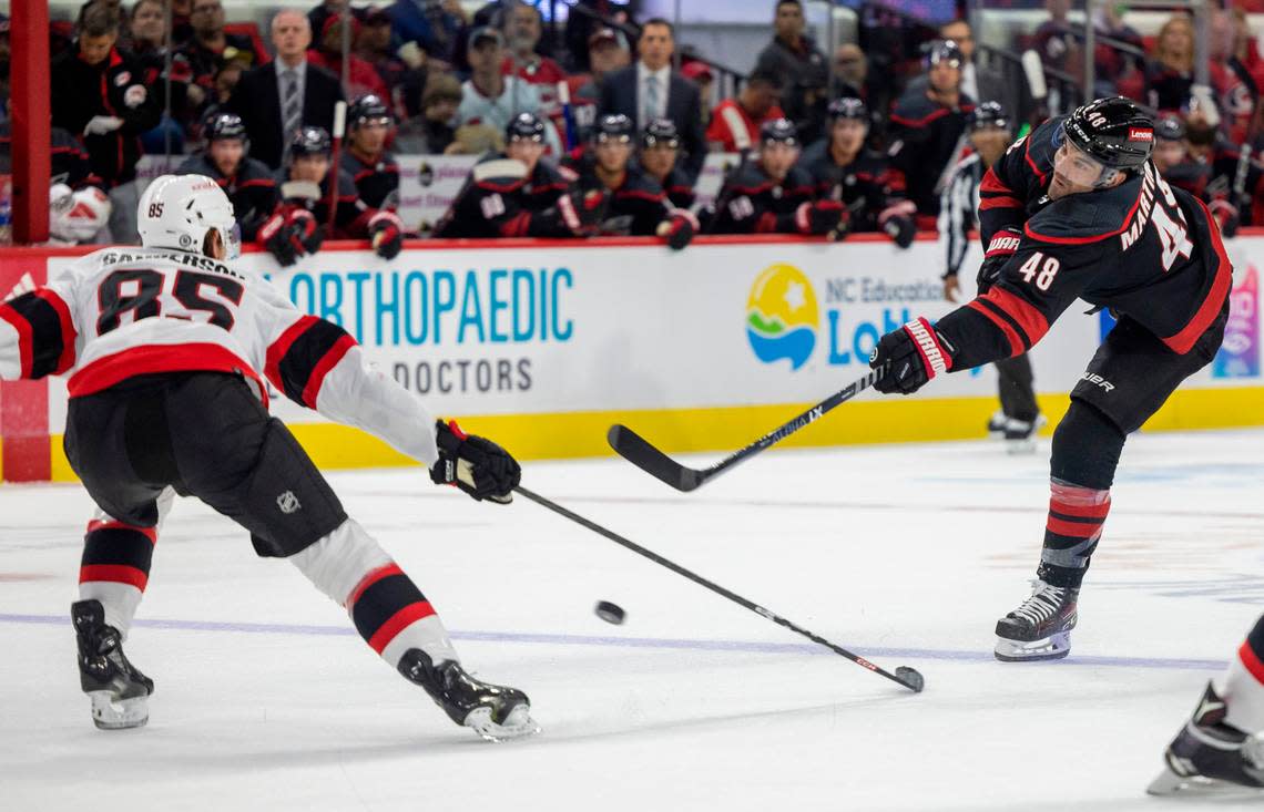 The Carolina Hurricanes Jordan Martinook (48) takes a shot on the Ottawa Senators goalie Joonas Korpisalo (70) in the first period on Wednesday, October 11, 2023 at PNC Arena, in Raleigh N.C. Robert Willett/rwillett@newsobserver.com