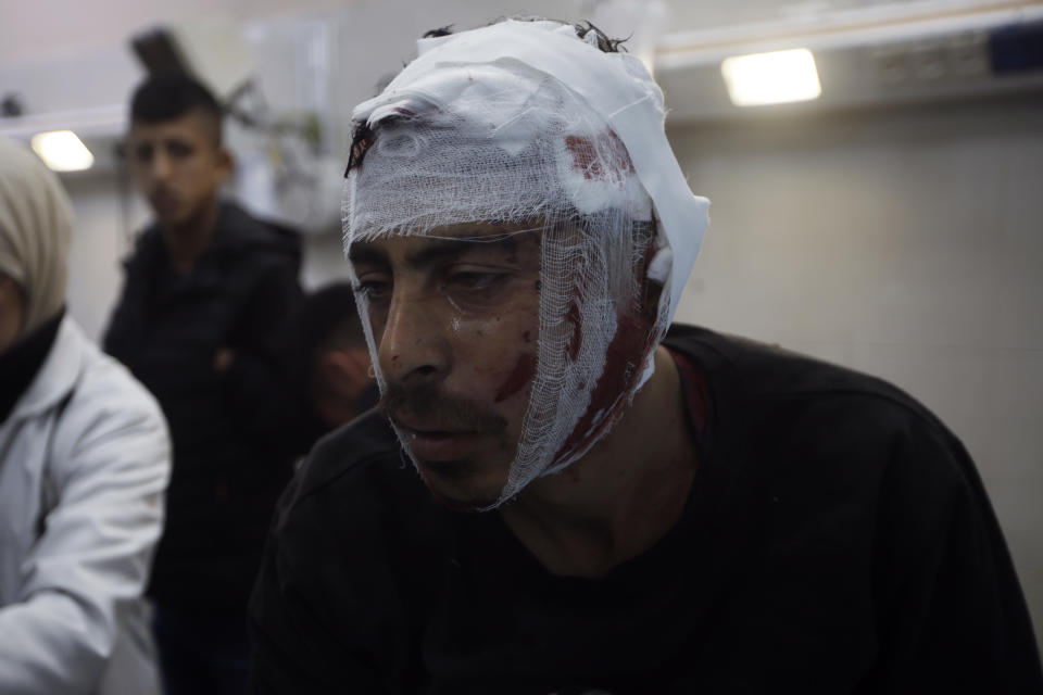 A Palestinian wounded in the Israeli bombardment of the Gaza Strip receives treatment at the Nasser hospital in Khan Younis, Southern Gaza Strip, Monday, Jan. 22, 2024. (AP Photo/Mohammed Dahman)