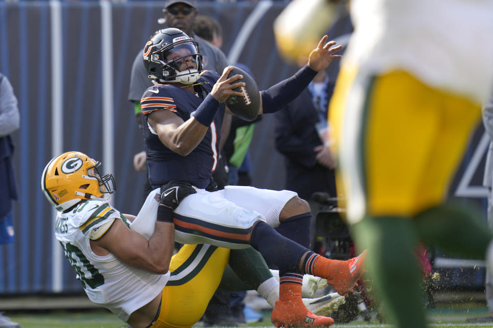Green Bay Packers linebacker Lukas Van Ness tackles Chicago Bears quarterback Justin Fields during the first half of an NFL football game Sunday, Sept. 10, 2023, in Chicago. (AP Photo/Erin Hooley)