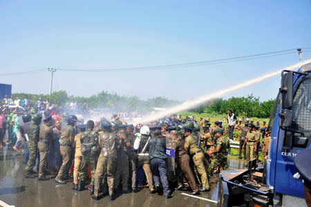 FILE PHOTO: Police used tear gas at demonstrators during a protest against the launching of a $5 billion Chinese investment zone by China Merchants Port Holdings Company, in Mirijjawila, Sri Lanka January 7, 2017. REUTERS/Stringer/File Photo