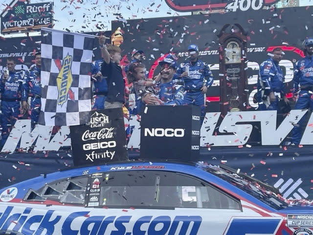 Kyle Larson celebrates with his family after winning the NASCAR cup series race, Sunday at Martinsville speedway. (AP Photo/Steve Reed)