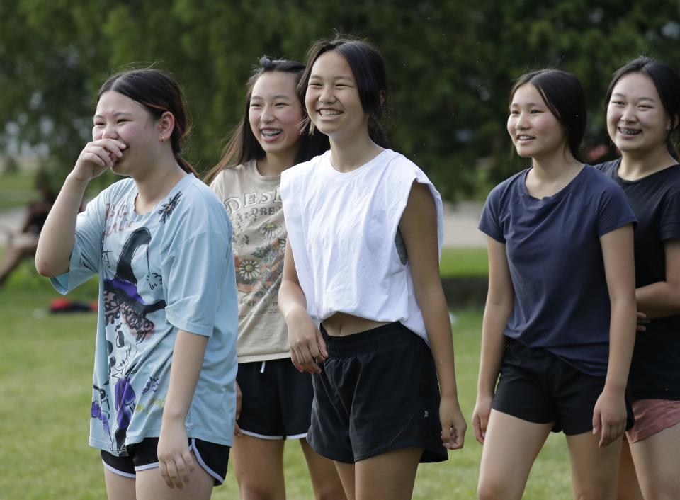 Students from the Appleton area, Neenah and Oshkosh school districts enjoy themselves Thursday, July 14, 2022, during the Cross Court Conversation Youth Volleyball Camp at Kiwanis Park in Appleton, Wis.