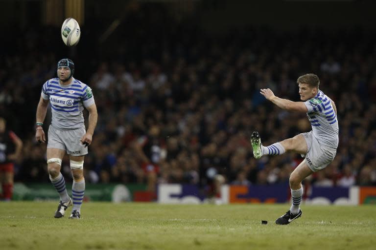 Saracens' English fly-half Owen Farrell (R) kicks a penalty during the European Cup final rugby union match between Toulon and Saracens in Cardiff on May 24, 2014