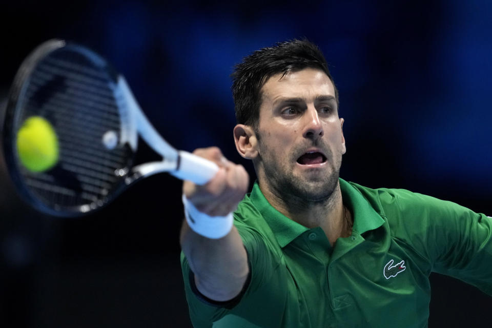 Serbia's Novak Djokovic hits a forehand to Norway's Casper Ruud during their singles final tennis match of the ATP World Tour Finals at the Pala Alpitour, in Turin, Italy, Sunday, Nov. 20, 2022. (AP Photo/Antonio Calanni)