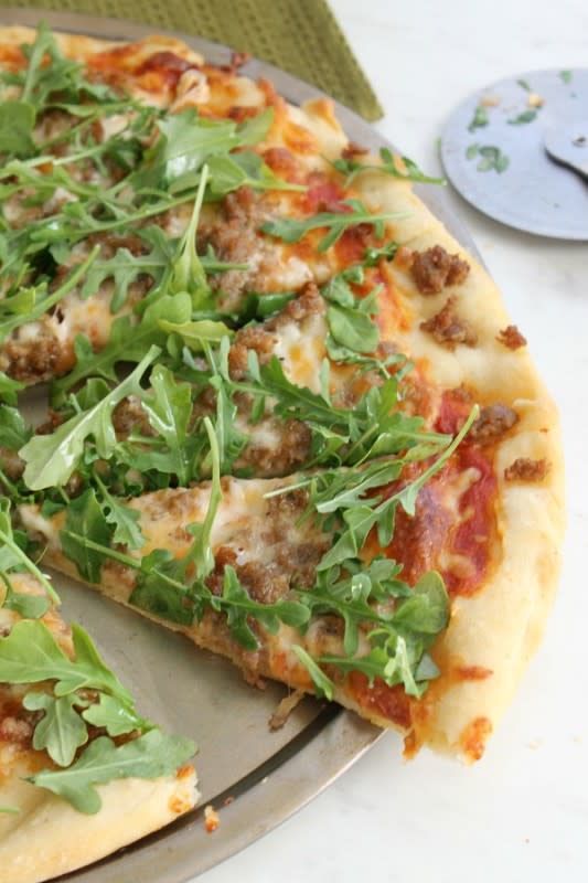 <p>The Bitter Side of Sweet</p><p>This homemade sausage arugula pizza is bursting with the bold flavor of peppery arugula and flavorful sausage. </p><p><strong>Get the recipe: <a href="http://www.thebittersideofsweet.com/2016/10/23/sausage-arugula-pizza/" rel="nofollow noopener" target="_blank" data-ylk="slk:Sausage Arugula Pizza;elm:context_link;itc:0;sec:content-canvas" class="link rapid-noclick-resp">Sausage Arugula Pizza</a></strong></p>