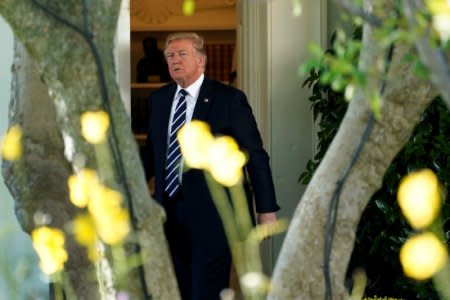 U.S. President Donald Trump walks out from the Oval Office of the White House in Washington, U.S., before his departure to Greer, South Carolina, October 16, 2017. REUTERS/Yuri Gripas